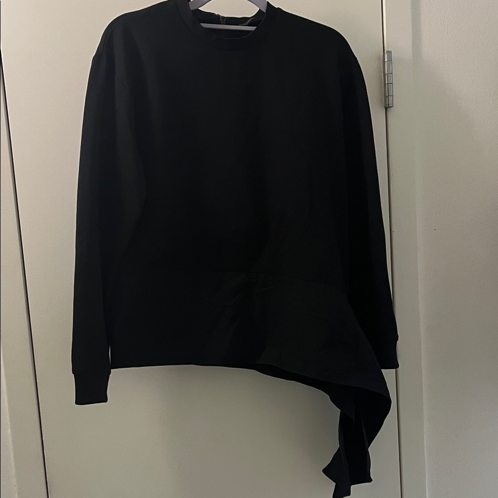 Women's top with assymetrical detail. Excellent condition.
